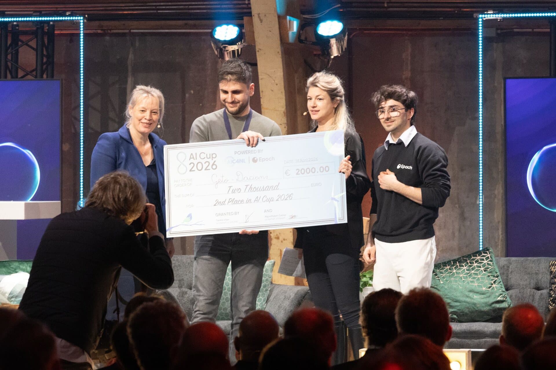 Team Geto-Dacians receiving the €2,000 cheque for 2nd place at the AI Cup 2026